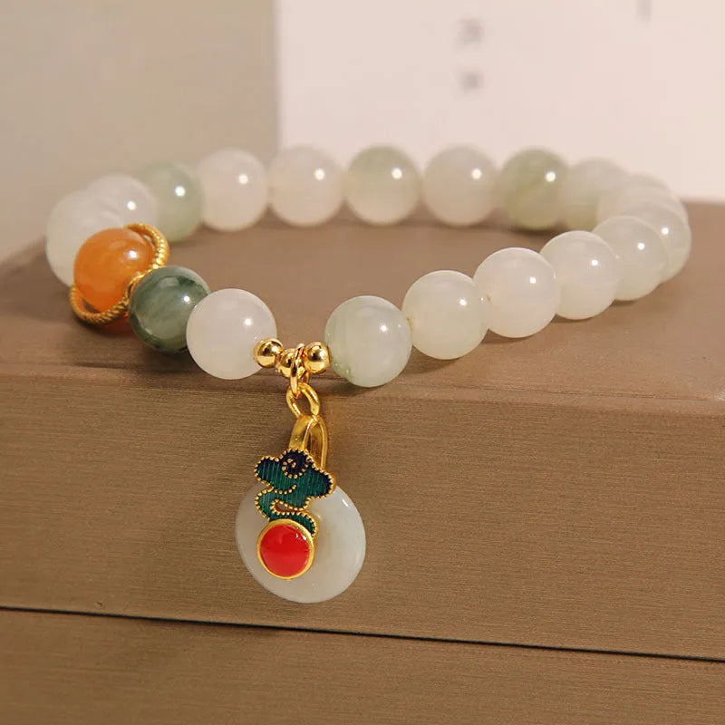 Women's ice jade crystal bracelet with pearl accents and retro design on display