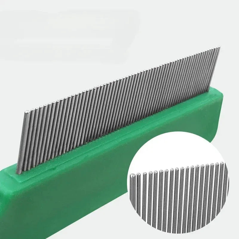 Green plastic handle flea comb with stainless steel pins for dogs and cats, shown next to a ruler indicating 129mm length.
