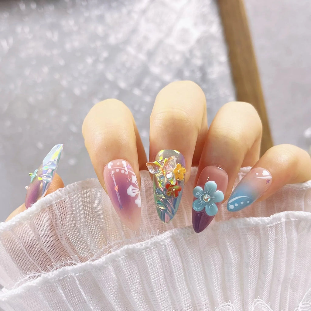 Handmade nail art sculptures with colourful embossed flower and butterfly designs