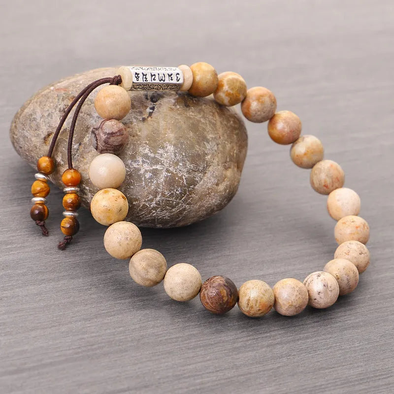 Wood colour stone bead bracelet with handmade construction on wrist
