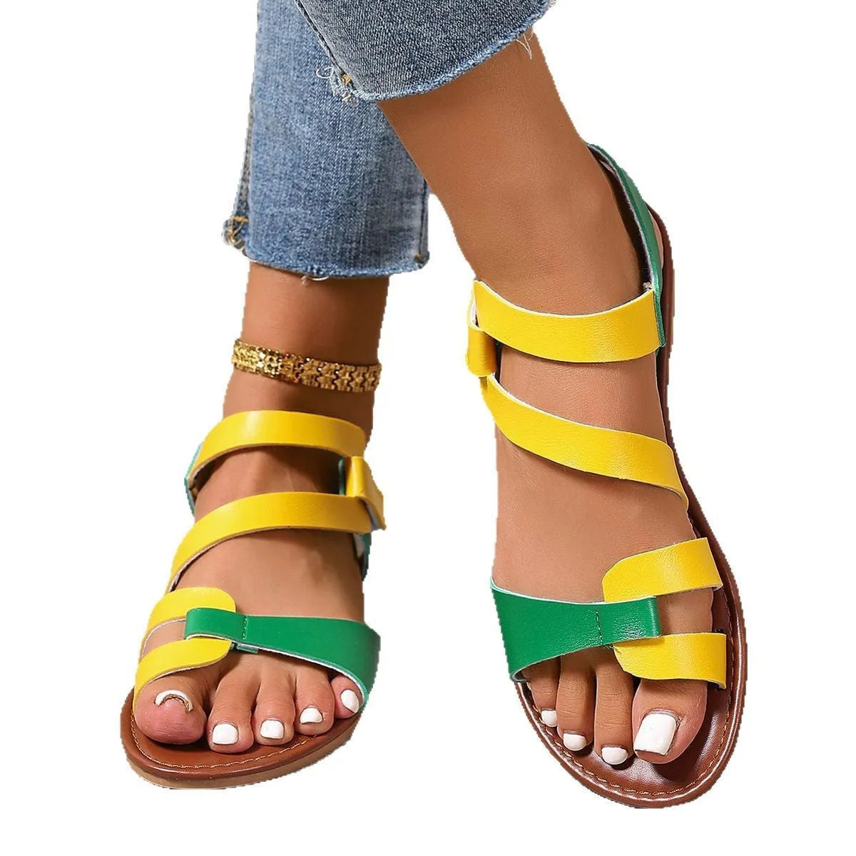 Women's flat sandals with a velcro strap, in black PU leather with a round toe and rubber sole.