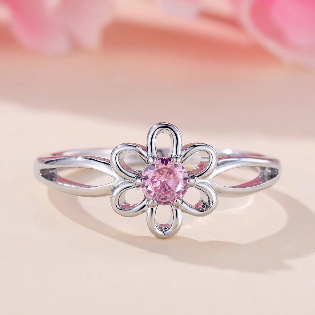 Lady's copper flower hollowed ring with electroplated finish in white gold powder colour on white background