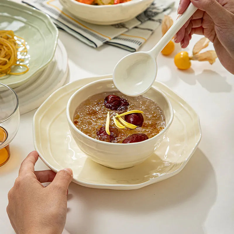 Seven-piece solid colour ceramic tableware set in a gift box, showing minimalist Japanese style plates and bowls.
