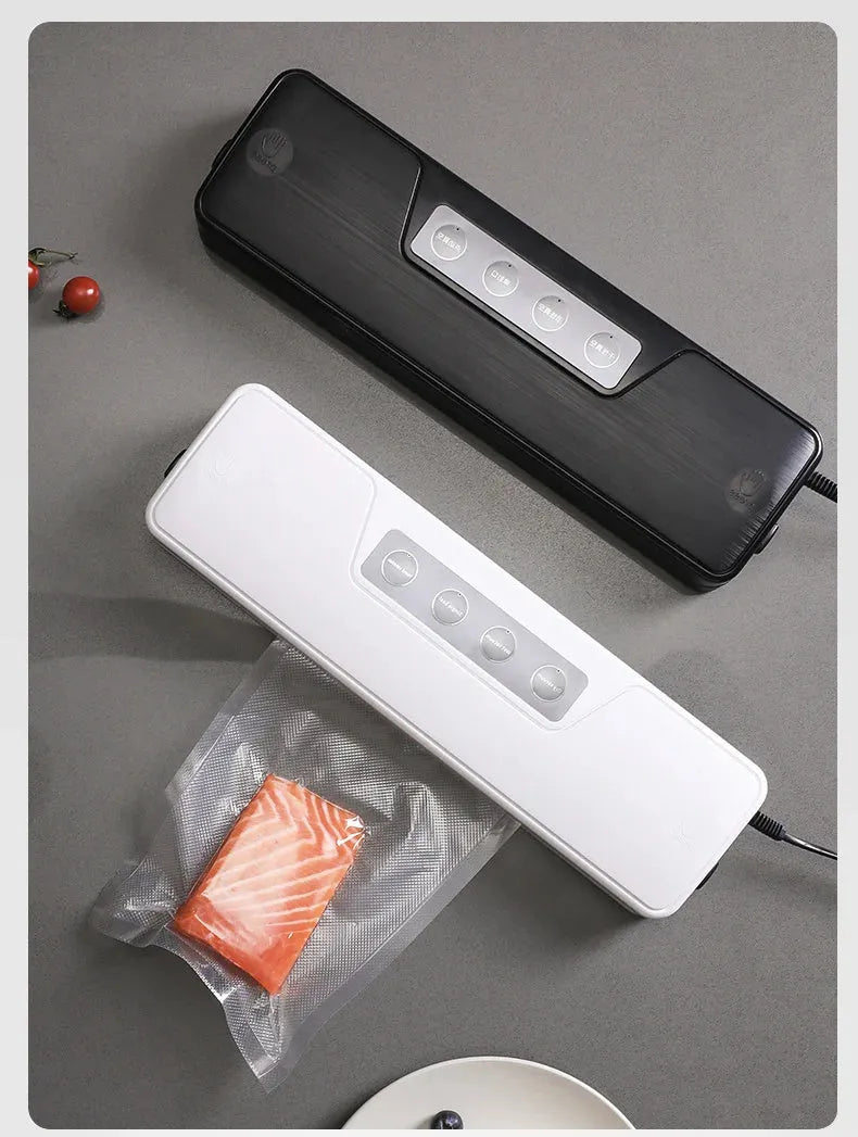 White automatic household vacuum sealer machine on a kitchen countertop.