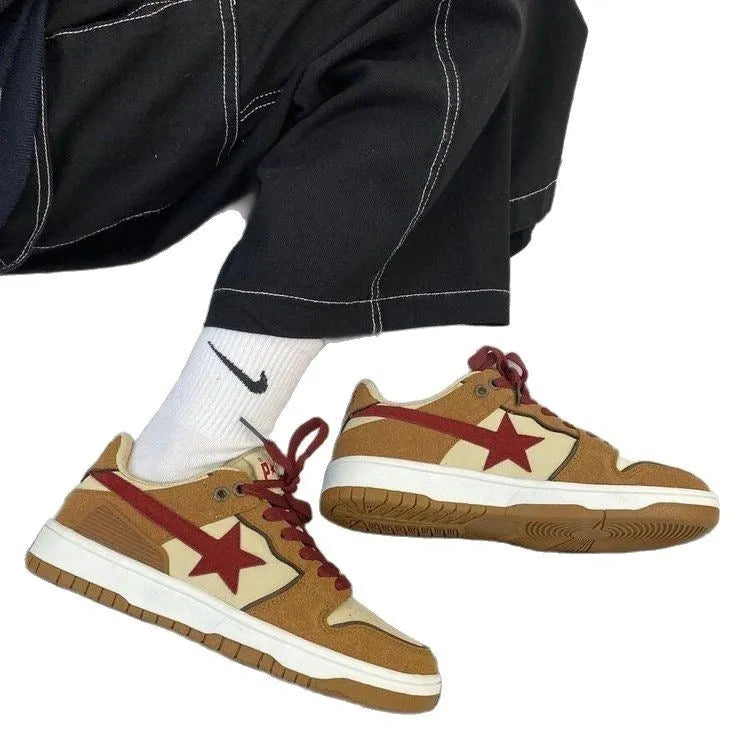 Brown low-top platform sneakers with sequins, lace-up fastening, and rubber sole on light background