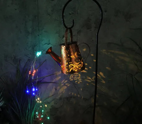 Tapered butterfly pattern solar garden lamp with iron construction and warm white finish