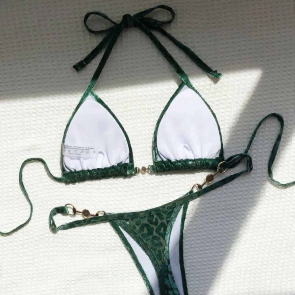 Blue leopard print women's T-shaped swimsuit bikini with spandex on a mannequin.