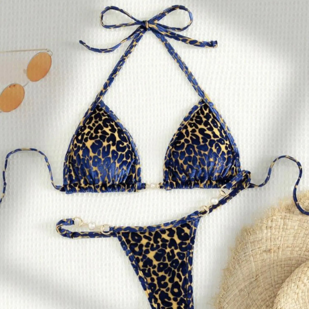 Blue leopard print women's T-shaped swimsuit bikini with spandex on a mannequin.