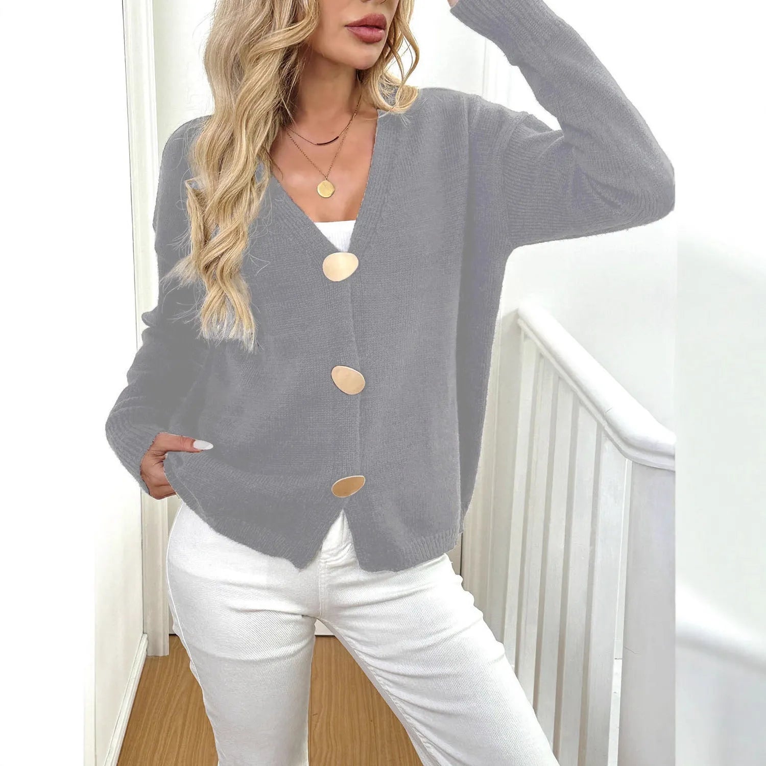 Women's grey deer plush sweater coat with long princess sleeves on a hanger.