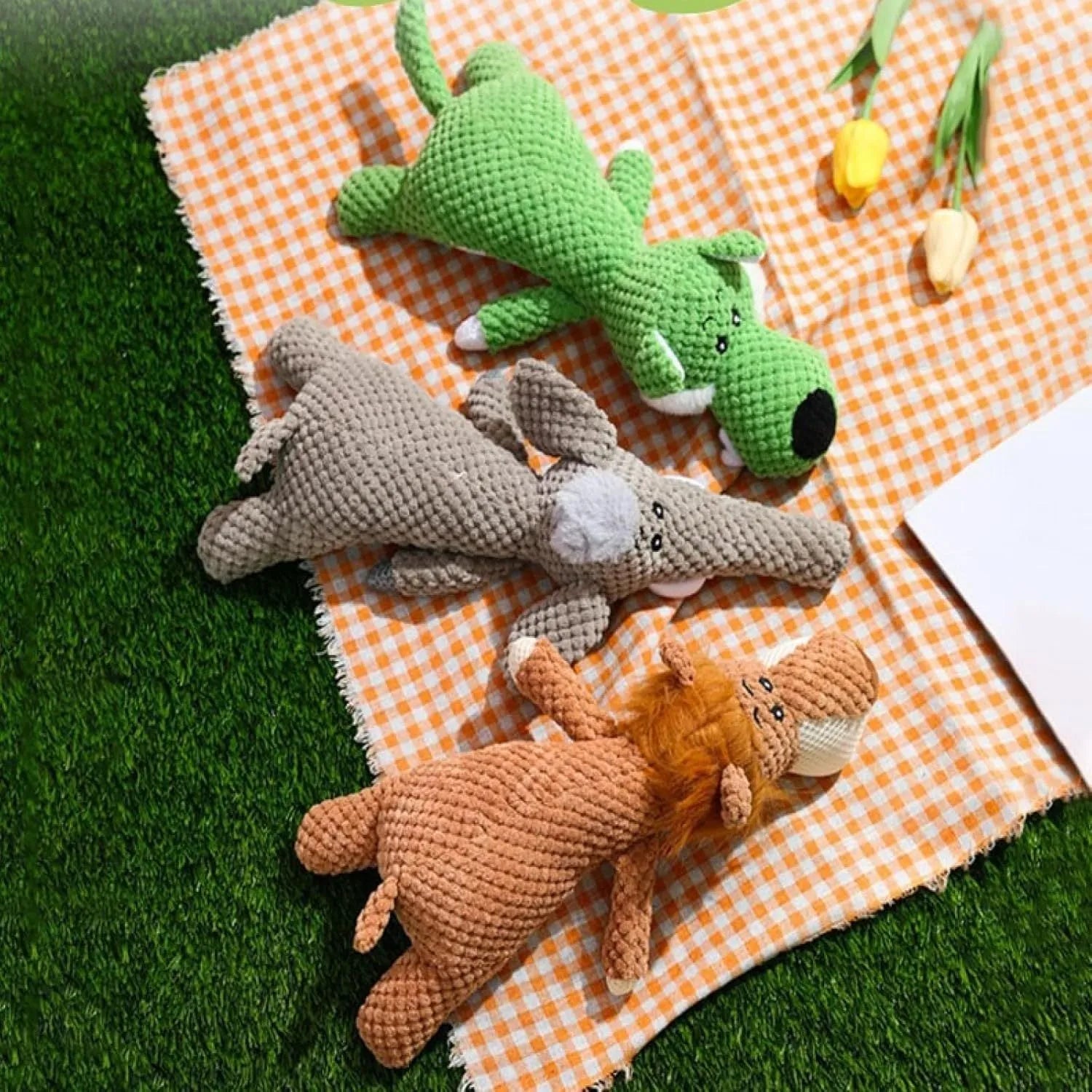 Plush corn cob dog toy in green with textured surface and squeaker for teeth cleaning