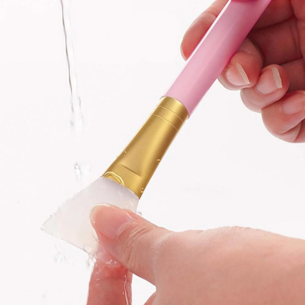 Reusable silicone face and body mask applicator brush in six colour options on a white background.