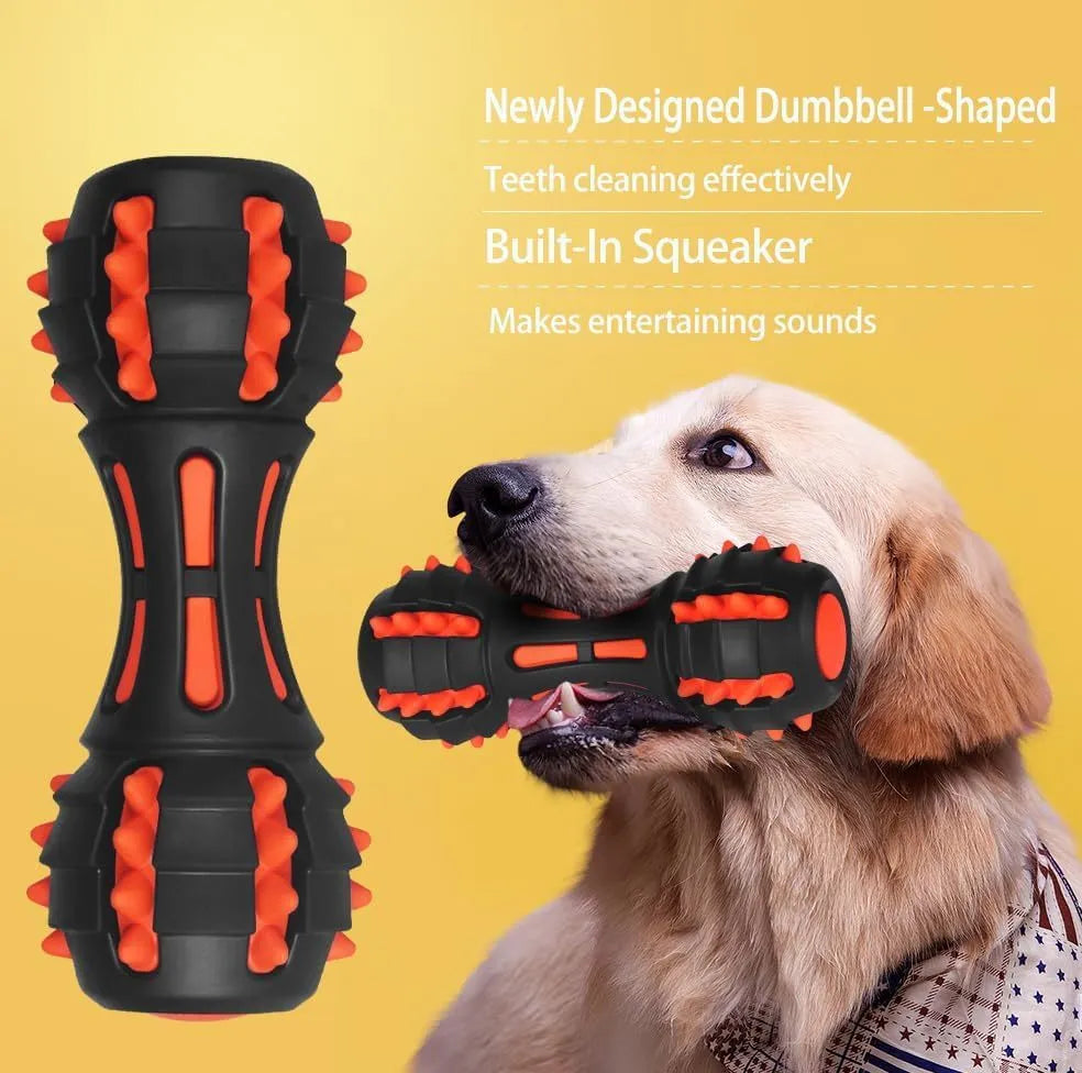 Red dumbbell-shaped rubber dog chew toy for medium and large breeds on a plain background.