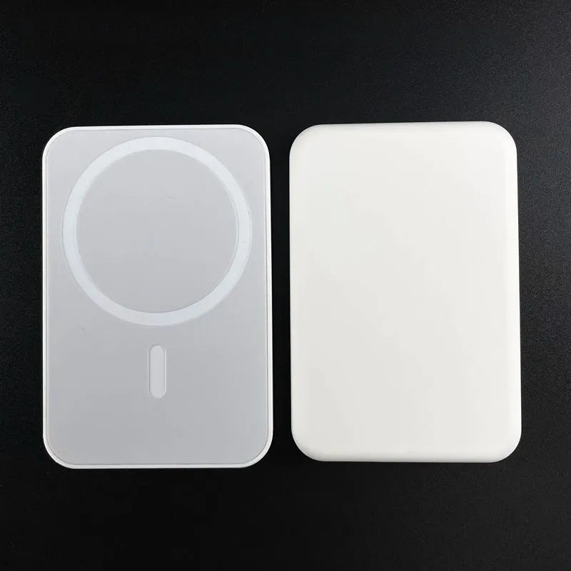 White portable magnetic wireless charger power bank showing compact design and charging surface