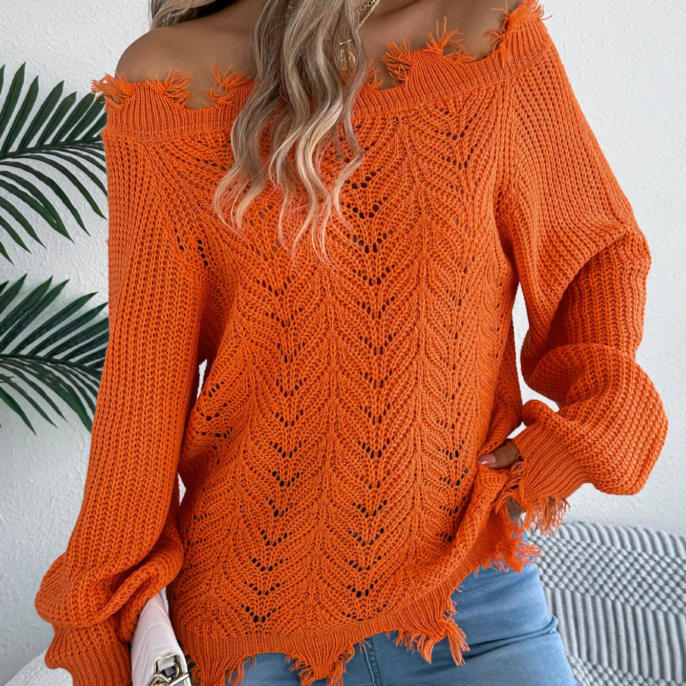 White cut off-the-shoulder pullover sweater with hollow-out long sleeves and street fashion styling