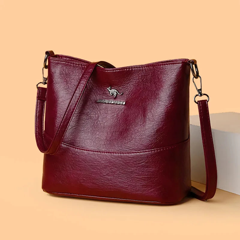 Women's solid colour soft leather shoulder bag with sewing line in black, ginger yellow, or wine red
