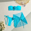 Women's pink tube top swimsuit with a large 3D flower tie and a matching detachable skirt.