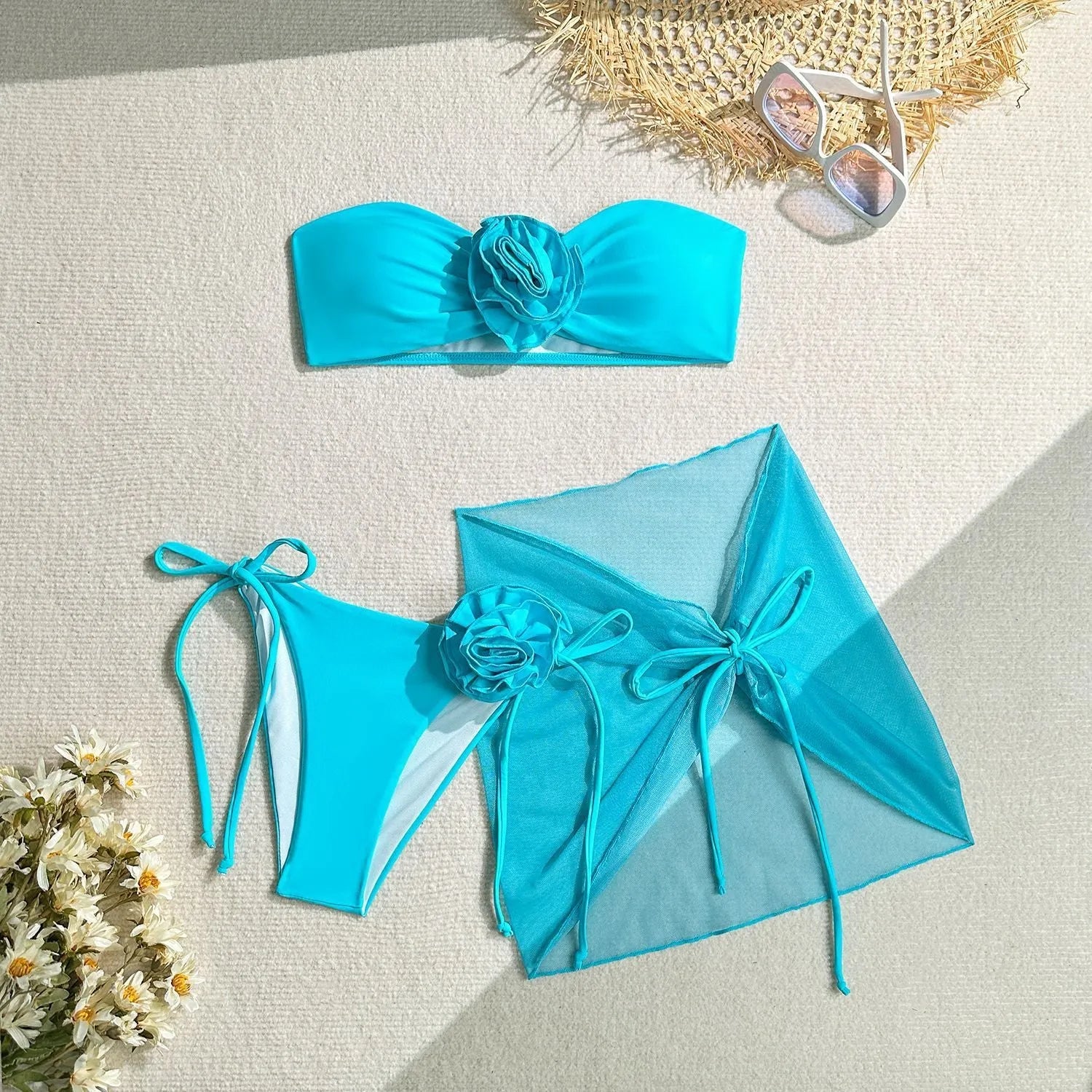 Women's pink tube top swimsuit with a large 3D flower tie and a matching detachable skirt.