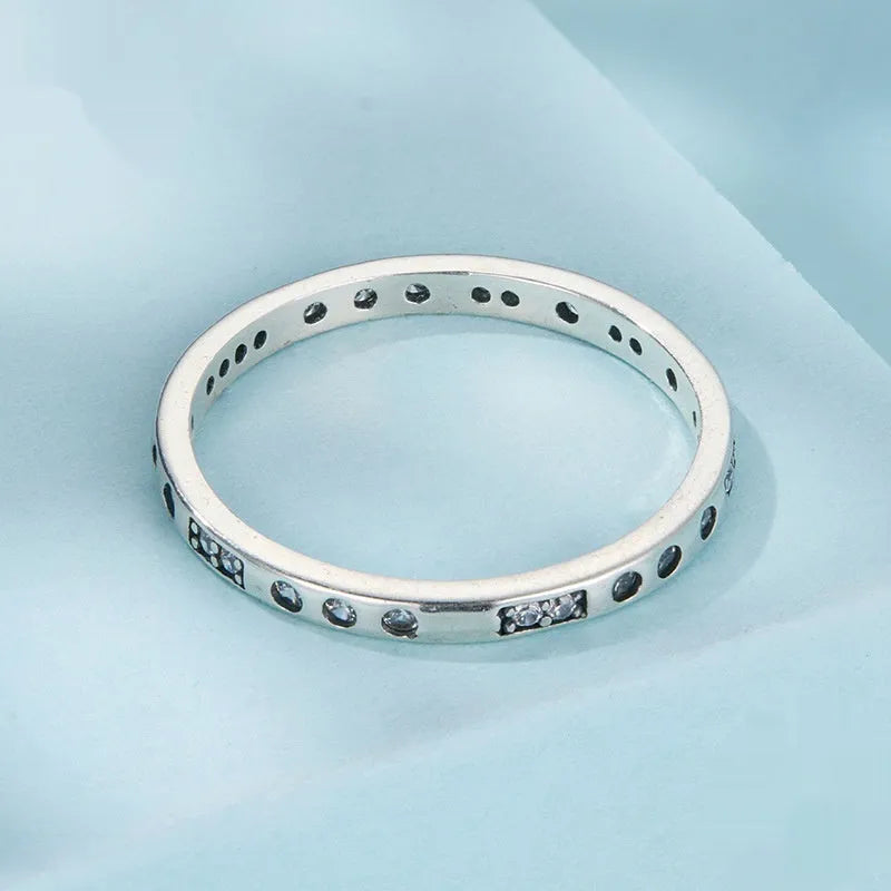 Silver alloy Moss Password I Love You ring with black oxidation treatment on a model's finger.