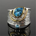 Blue zircon drop shape ring in Creative Chinese Style design, showing inlaid stones on an alloy band.