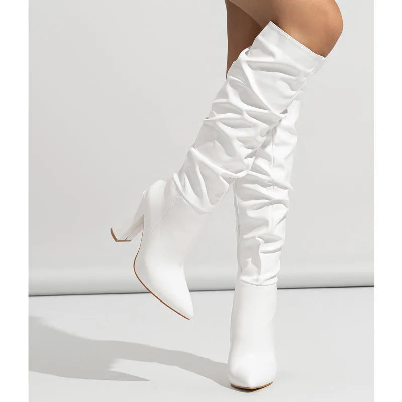 Pointed long women's high heel boots in solid colour with side zipper, super high heel above 8cm, artificial PU upper.