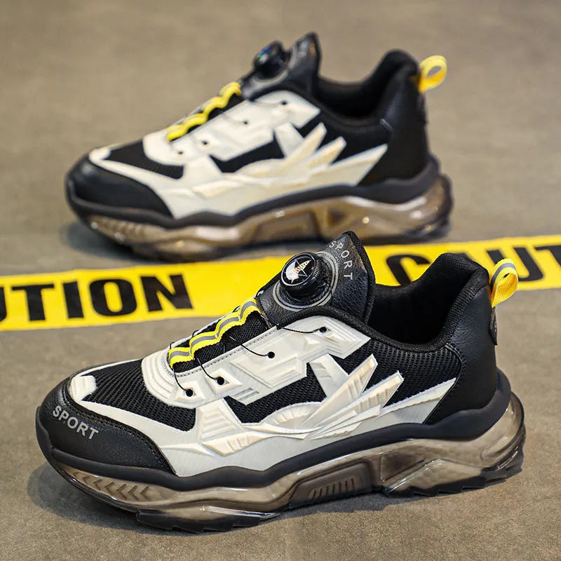 Men's black mesh casual sneakers with a rotating button closure and a low platform sole.