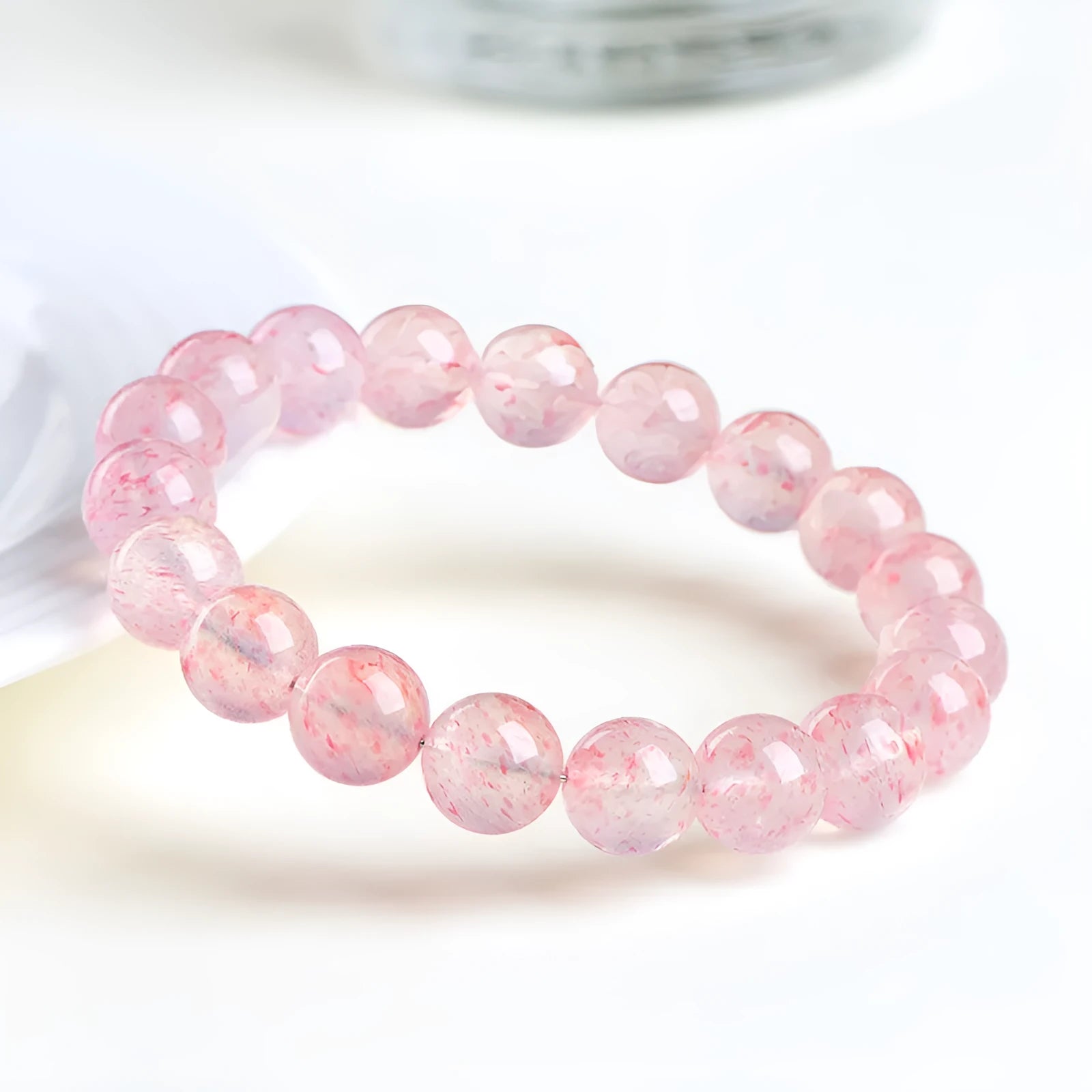 Strawberry quartz crystal bracelet with white water body geometric beads measuring 10-10.8mm