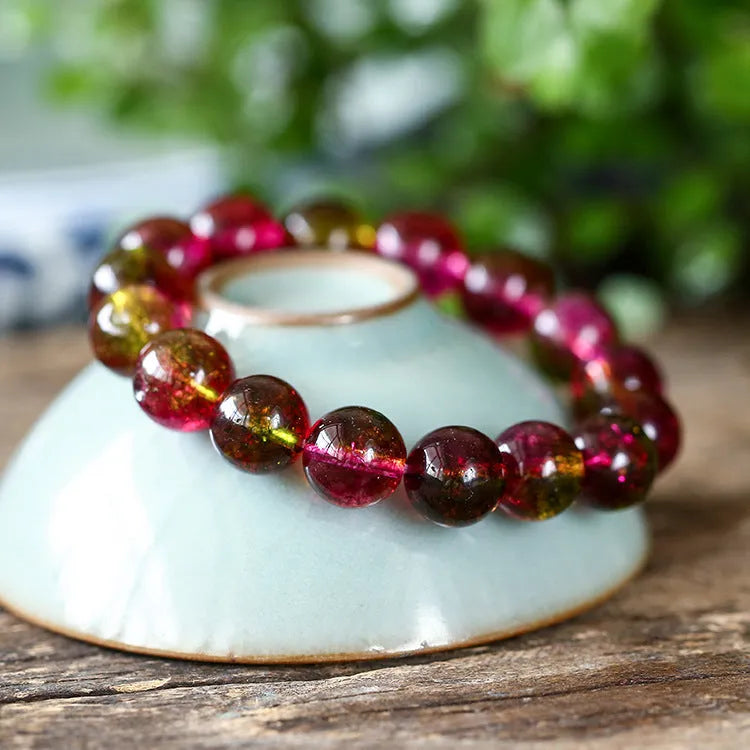 Women's watermelon crystal bracelet showing pastoral design elements on wrist, available in 6mm, 8mm, 10mm, and 12mm sizes.