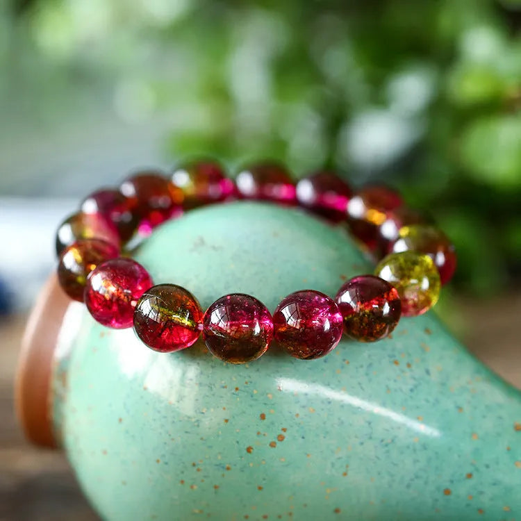 Women's watermelon crystal bracelet showing pastoral design elements on wrist, available in 6mm, 8mm, 10mm, and 12mm sizes.