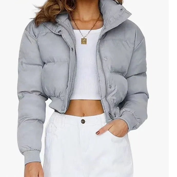 Women's loose polyester jacket in beige, black, blue or milky white colours with regular long sleeves