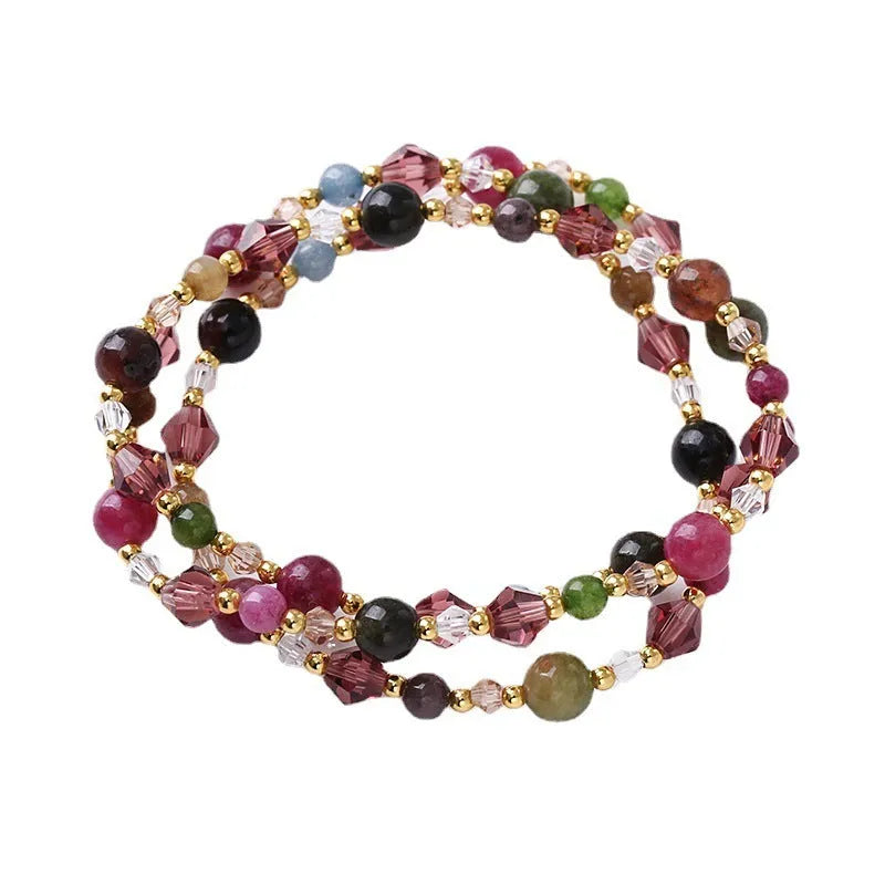 Handmade women's three-ring crystal bracelet with adjustable cord in tourmaline, strawberry quartz, or amethyst.