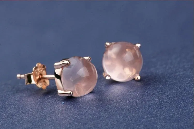 Rose gold coloured drop shaped stud earrings for women with a synthetic quartz stone.