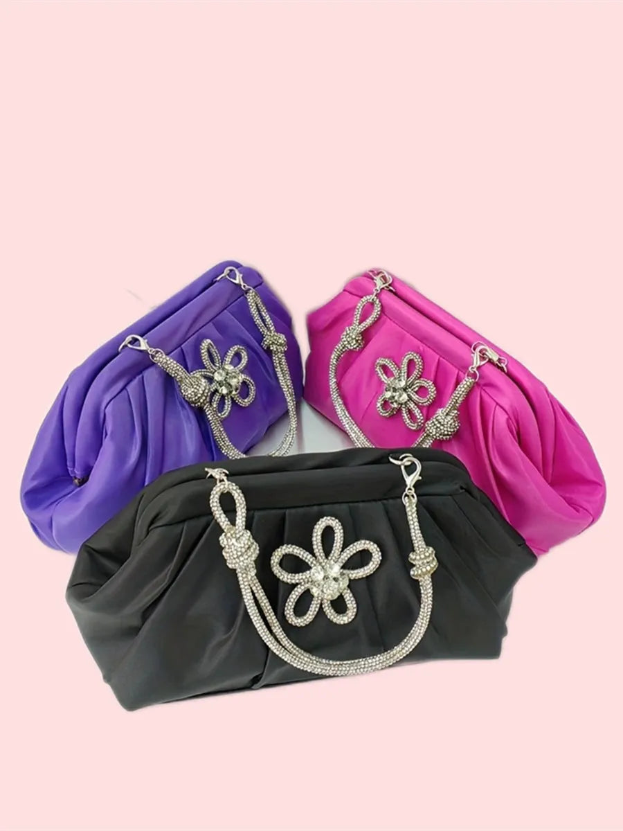 Women's black shell shape crossbody bag with diamond pattern and chain details showing internal document compartment
