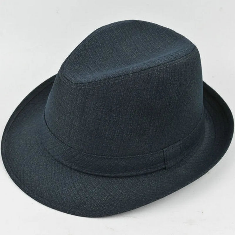 A men's brown fedora hat made from thickened suit material on a grey background.