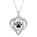 Copper necklace for women with a dog's paw print pendant on a cross chain.