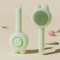 Self-cleaning pet brush with release button, stainless steel comb with rubber-tipped needles