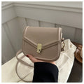 PU leather soft shell messenger bag with clamshell opening in a horizontal square shape.
