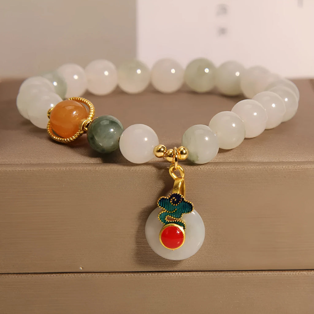 Women's ice jade crystal bracelet with pearl accents and retro design on display