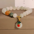 Women's ice jade crystal bracelet with pearl accents and retro design on display