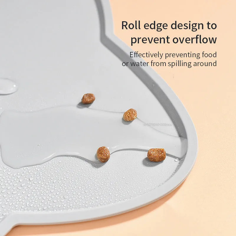 Waterproof silicone pet feeding mat in grey, cat head shape, 44x24cm, with a pet bowl on top