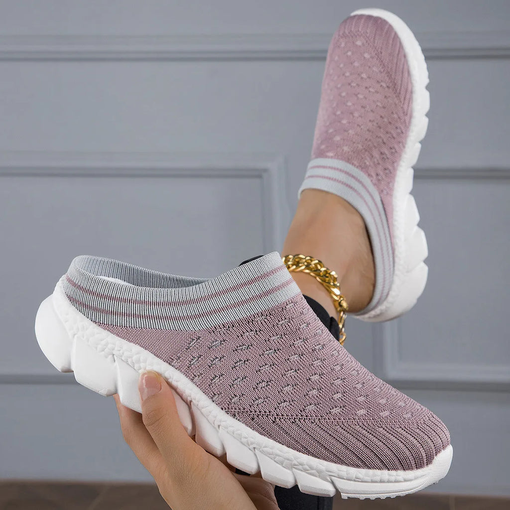 Women's striped Flyknit sports slipper in black with hollowed-out design and height-increasing sole.