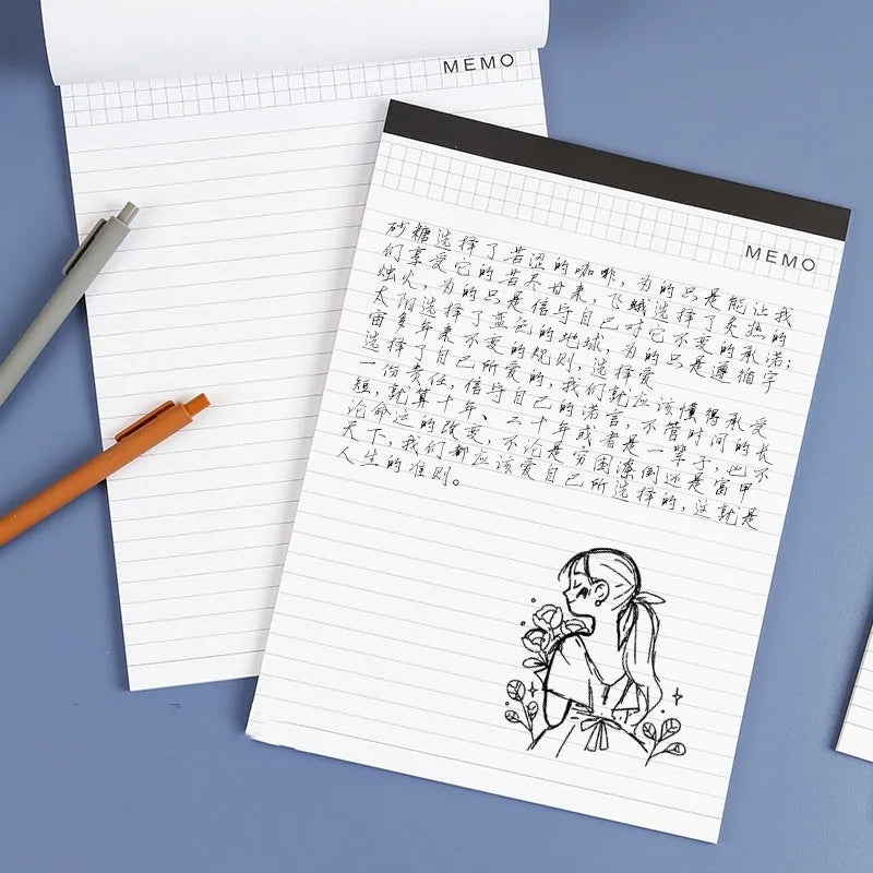 A4 tearable notebook with grid paper and a paper cover, shown open to reveal its pages.