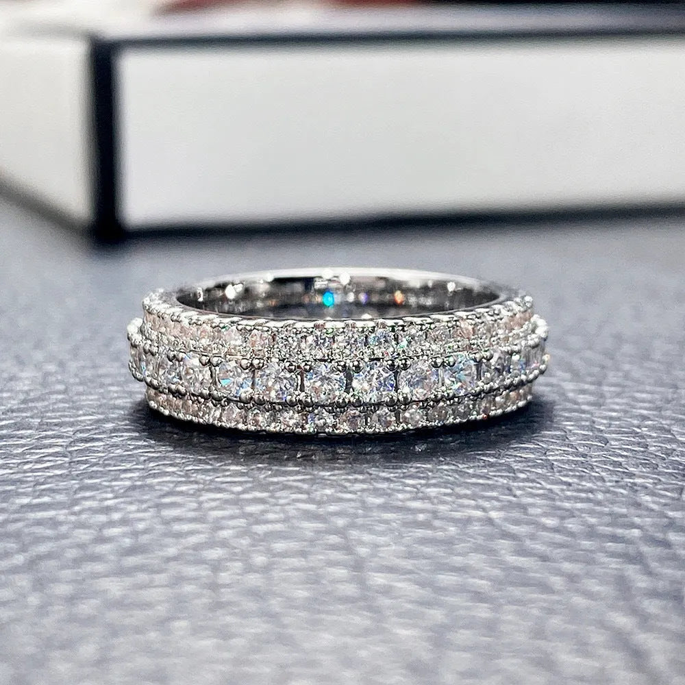 Personalised geometric triangle engagement ring with zircon stone in a choice of finishes.