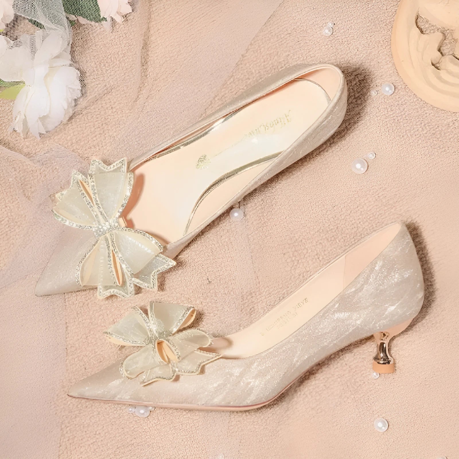 Women's champagne coloured sequined stiletto heel pumps with pointed toe.