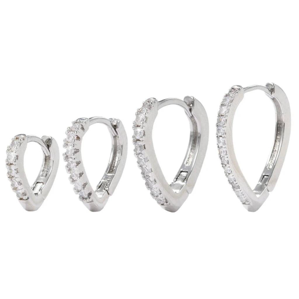 Geometric gold tone love heart clip-on earring for women on a white background.