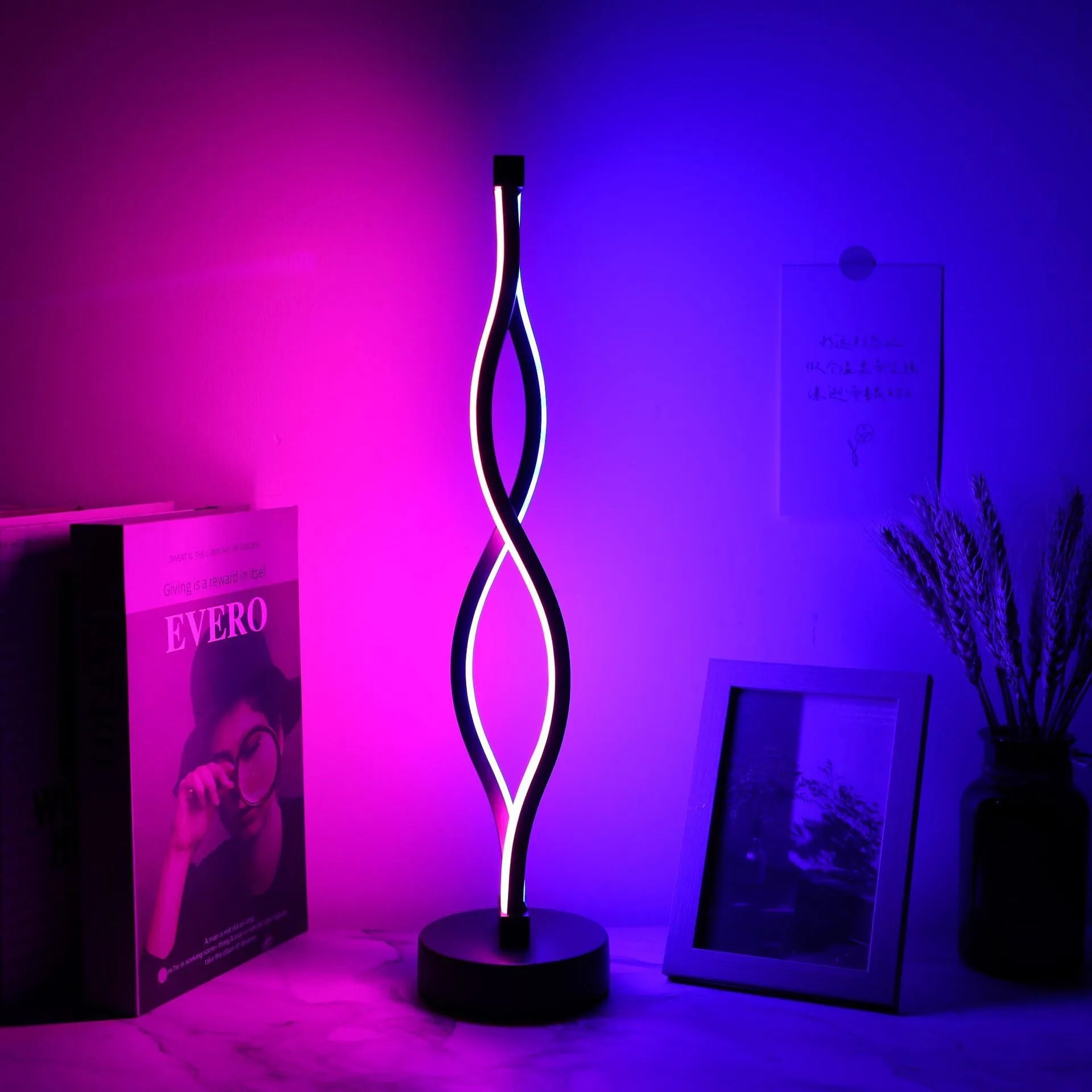Black aluminium desktop table lamp with dimming button and touch controls.