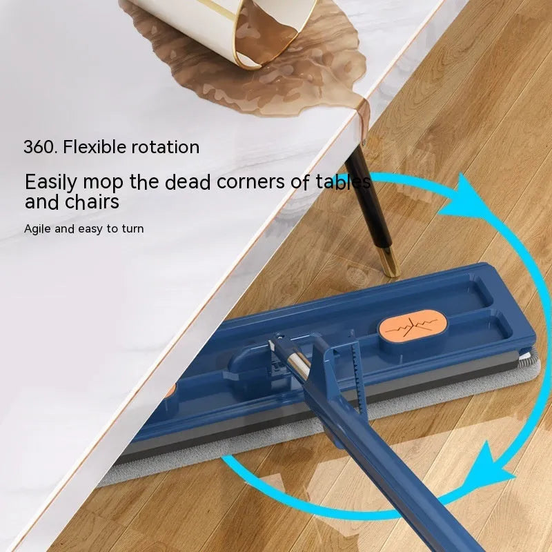 Large flat mop with long stainless steel handle and blue rotating mop head on a wooden floor.