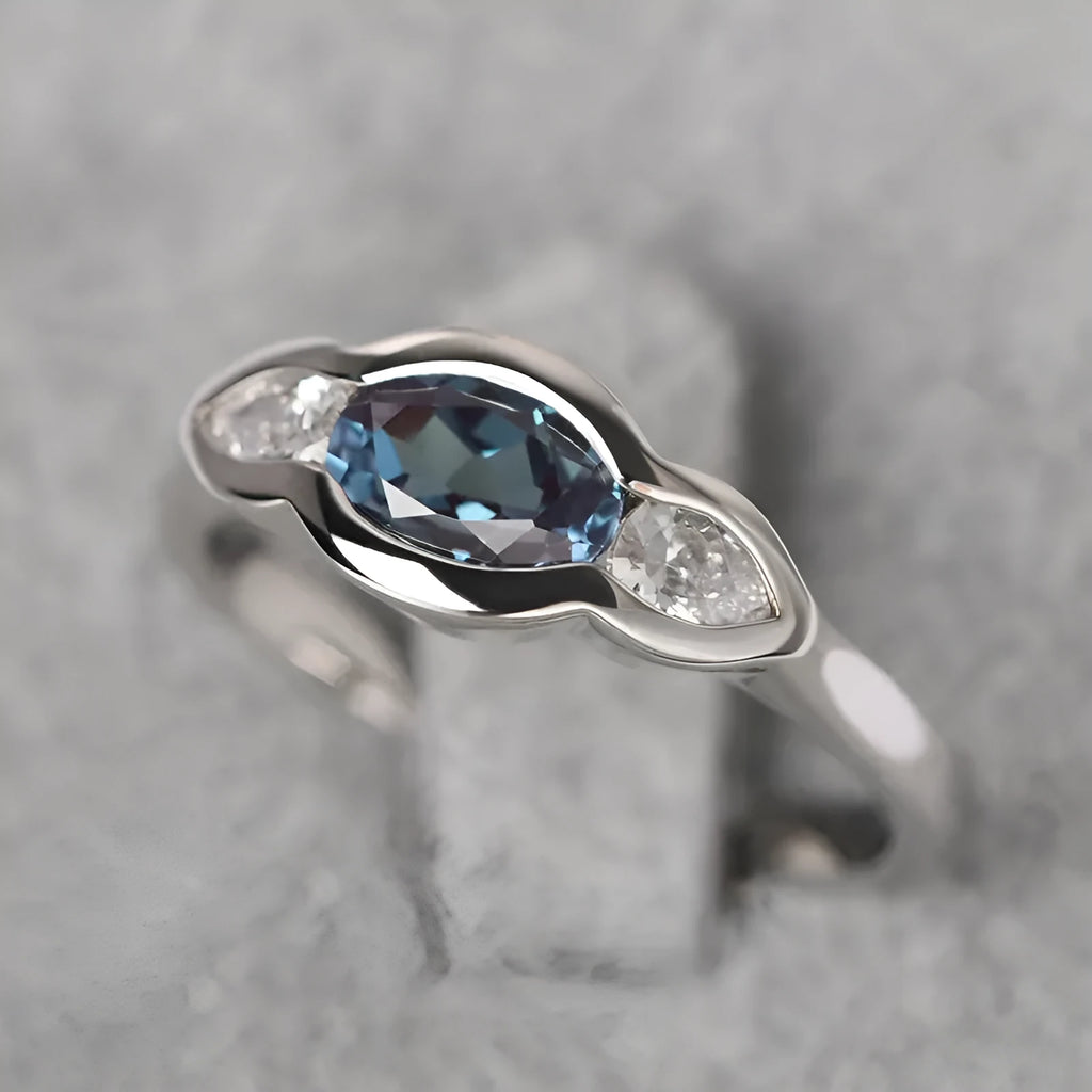 Geometric ellipse women's ring with inlaid zircon stones in Q941 white gold finish on copper