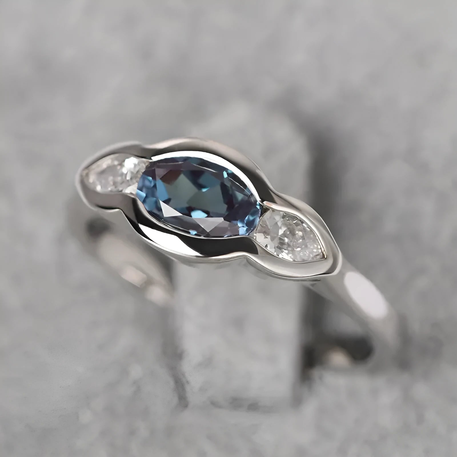 Geometric ellipse women's ring with inlaid zircon stones in Q941 white gold finish on copper