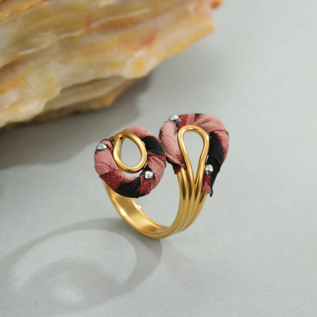 Leopard print stainless steel open mouth ring showing heart, star and geometric shapes.