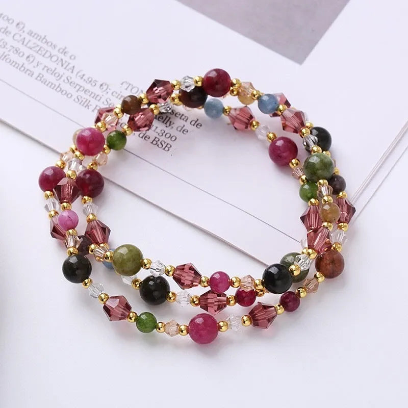 Handmade women's three-ring crystal bracelet with adjustable cord in tourmaline, strawberry quartz, or amethyst.